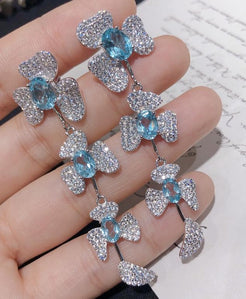 Petals in Flight Sterling Silver 925 Sky Blue Topaz Earrings